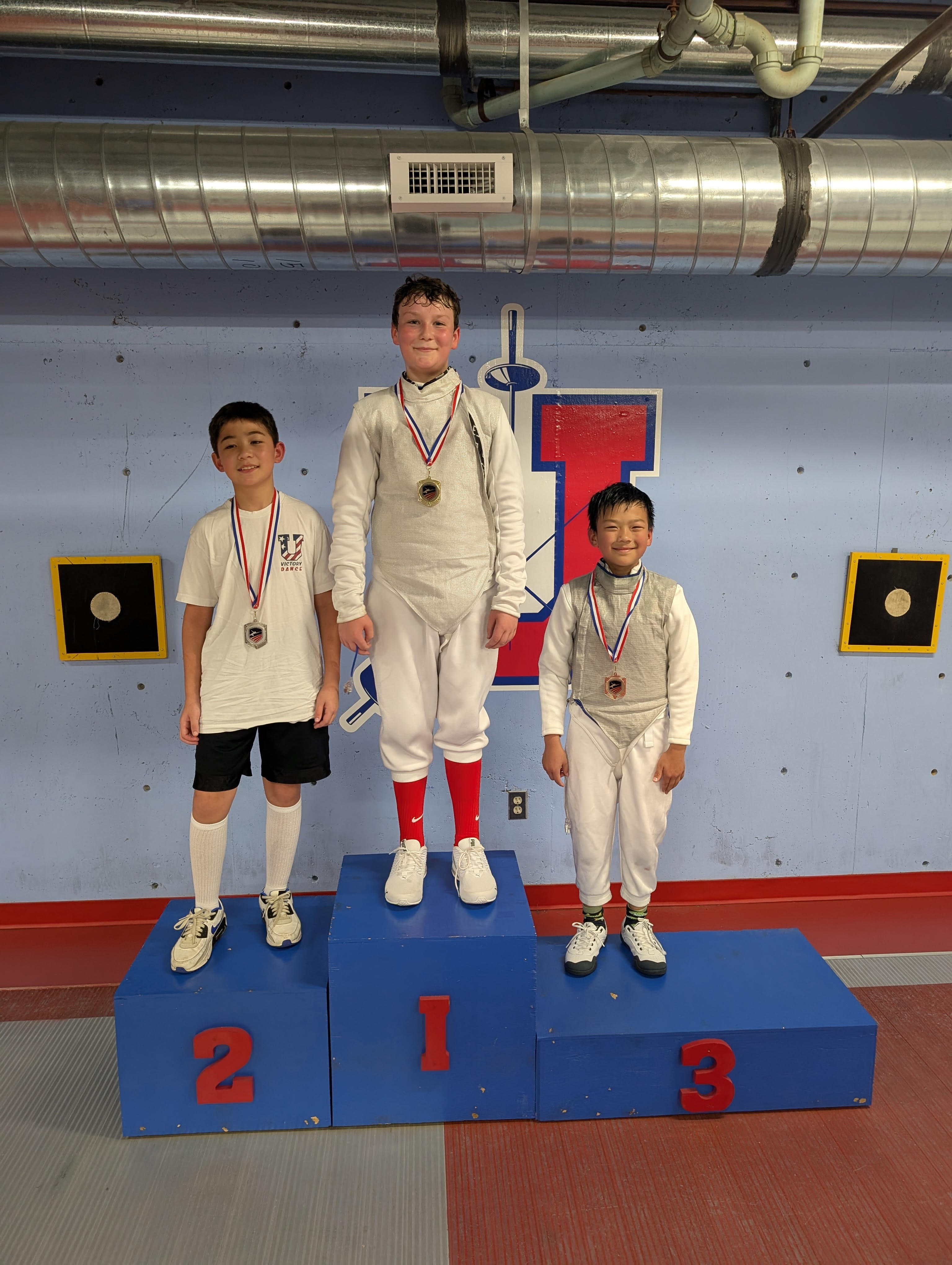 Archer Moorison celebrating his first place victory at the Easter Clash foil tournament held at Memphis University School in Tennessee