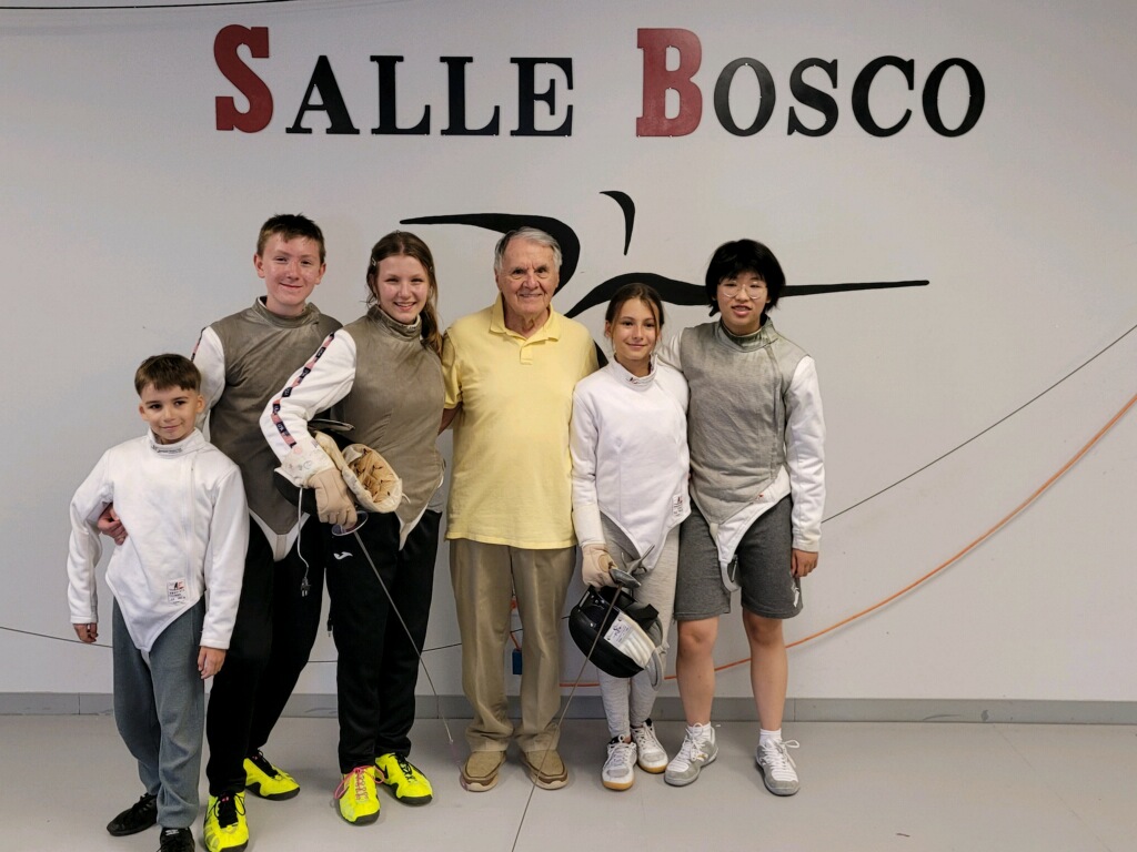Group photo of active foil competitors at Salle D'Armes Bosco after completing an intensive training session in Madison, Alabama