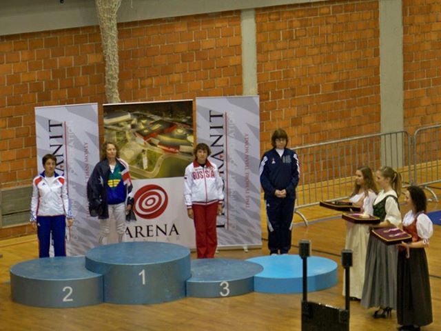 Marianne Bosco proudly displaying her bronze medal achievement at the World Championship epee competition, representing the highest level of international fencing